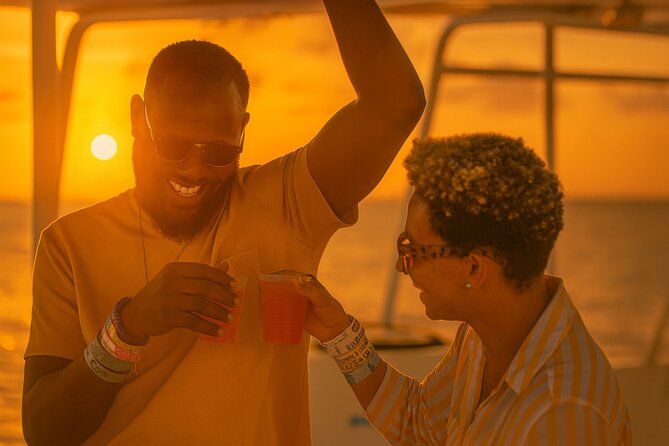Grand Bahama Catamaran Sunset Cruise with Drinks and Snacks - Onboard comfort: decks for photos, restrooms, and real staff help