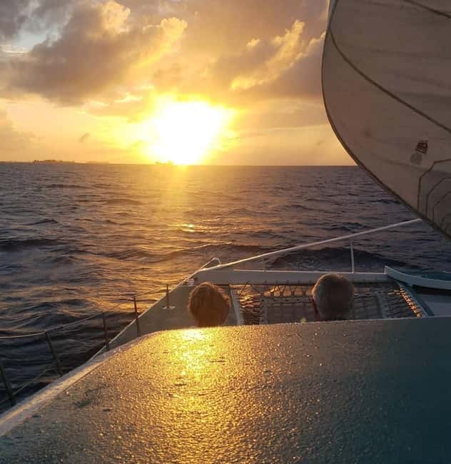 Sunset Cruise In Paradise - Boarding the Catamaran: Inside, Outside, and the Net Seating Moment